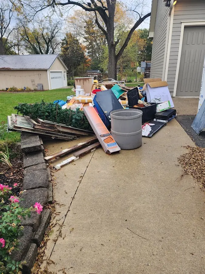 Dumpster being loaded with debris for Commercial Dumpster Rental in Lone Grove